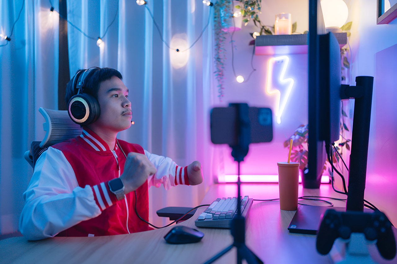 Twitch streamer gaming setup with neon lights and computer equipment